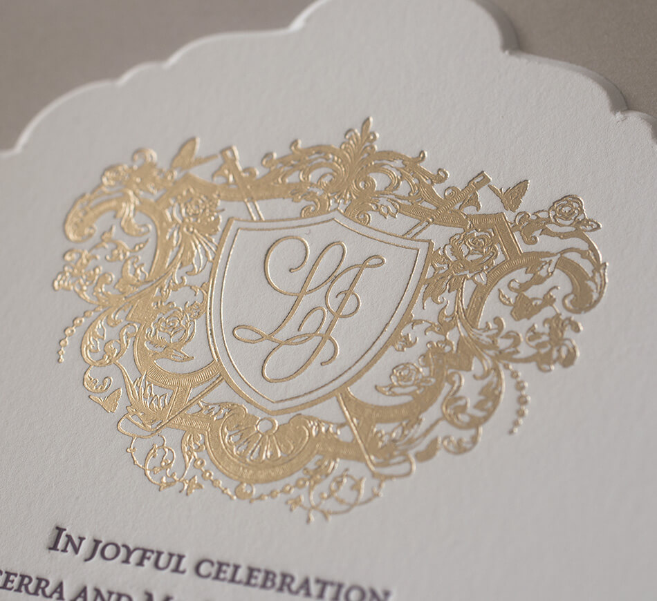 Gold foil stamped custom crest with roses, butterflies and golf clubs