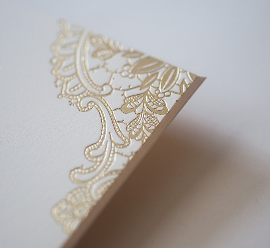 Gold lace motif on the invitation corner