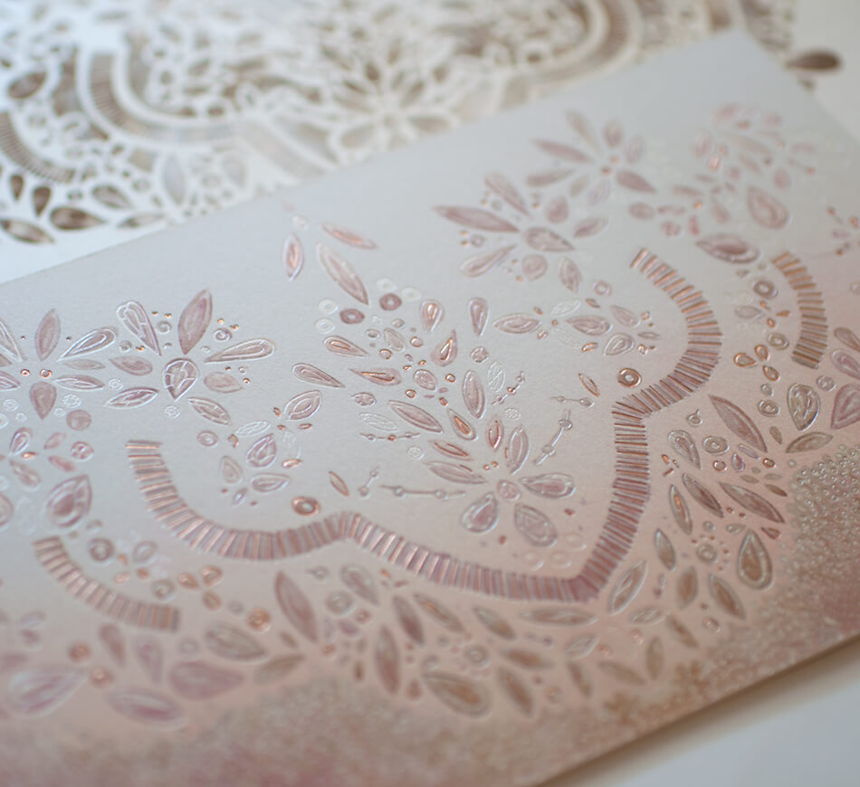 Rose gold accents on invitation back