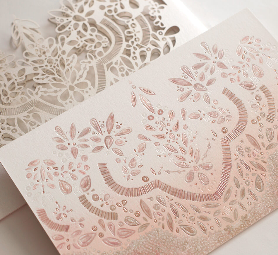 Pearl and rose gold foil details on invitation backer