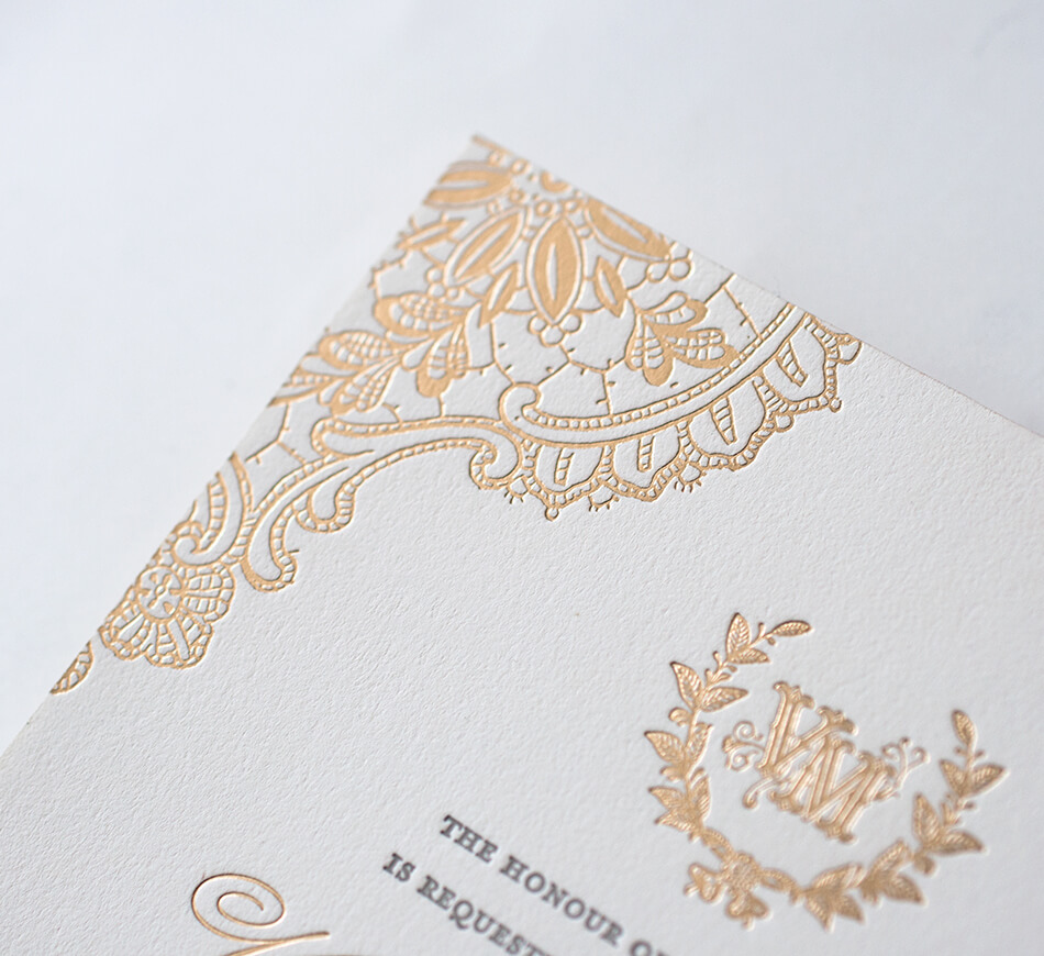 Gold foil lace detail on a letterpress invitation