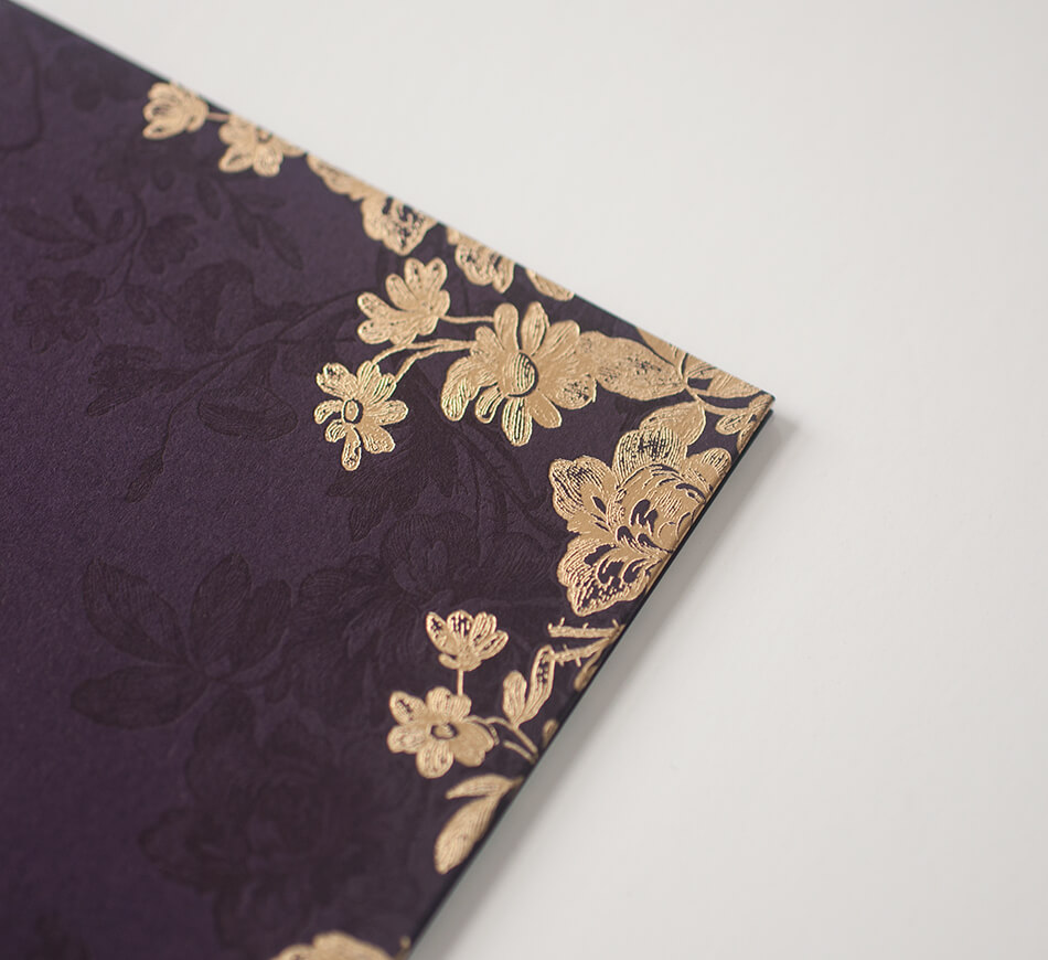 Gold foil and purple letterpress on a folder cover