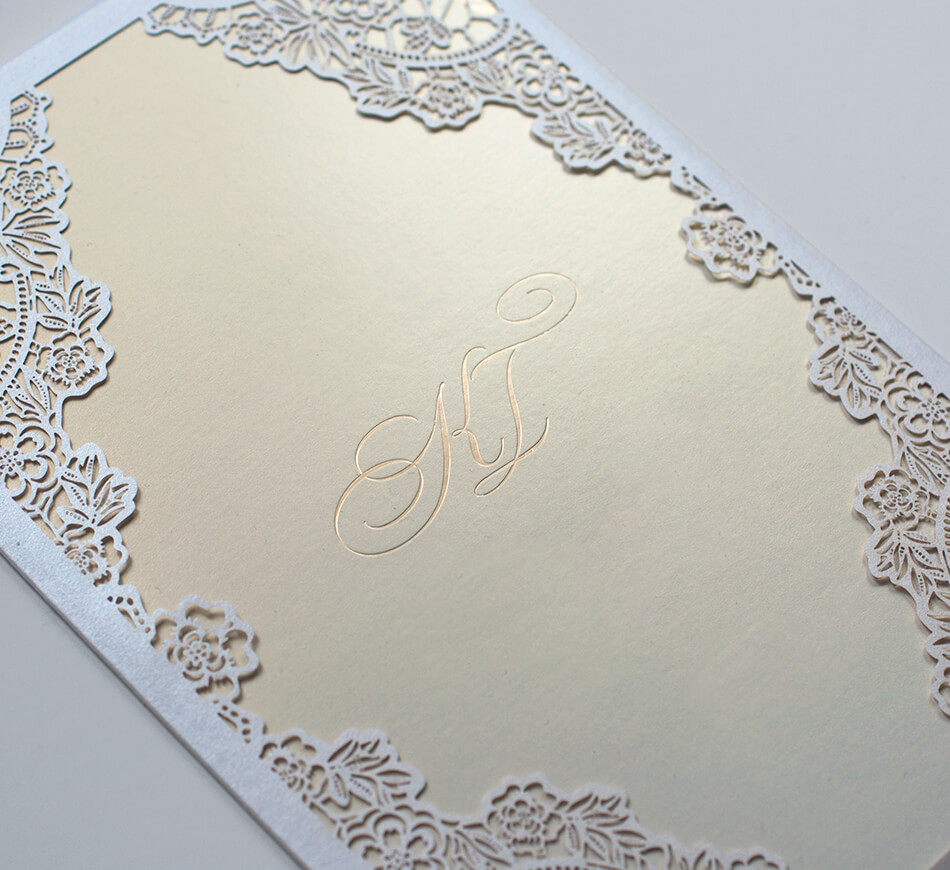 Lace laser cutting on an invitation sleeve