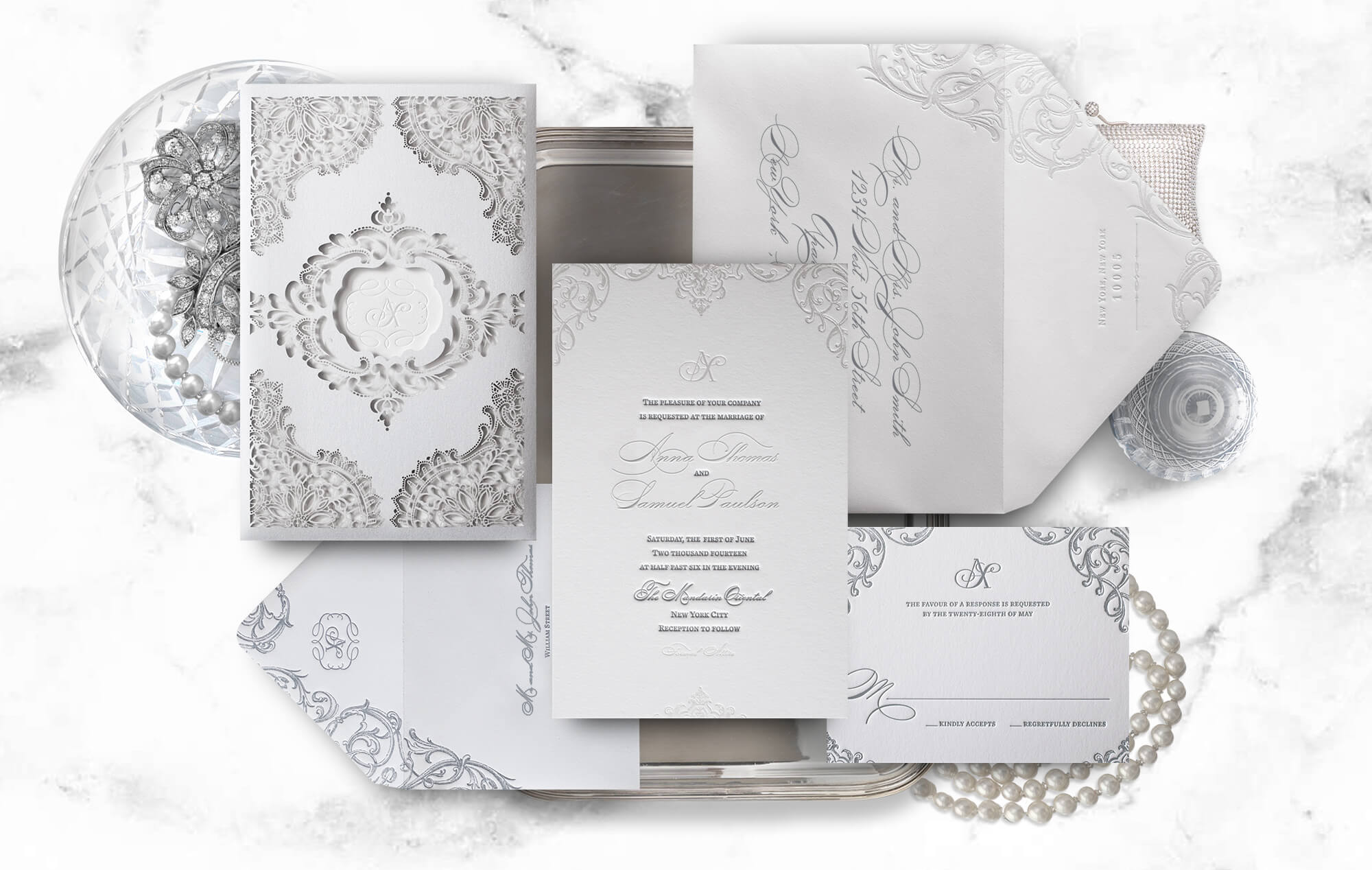 White wedding invitation with laser cut sleeve
