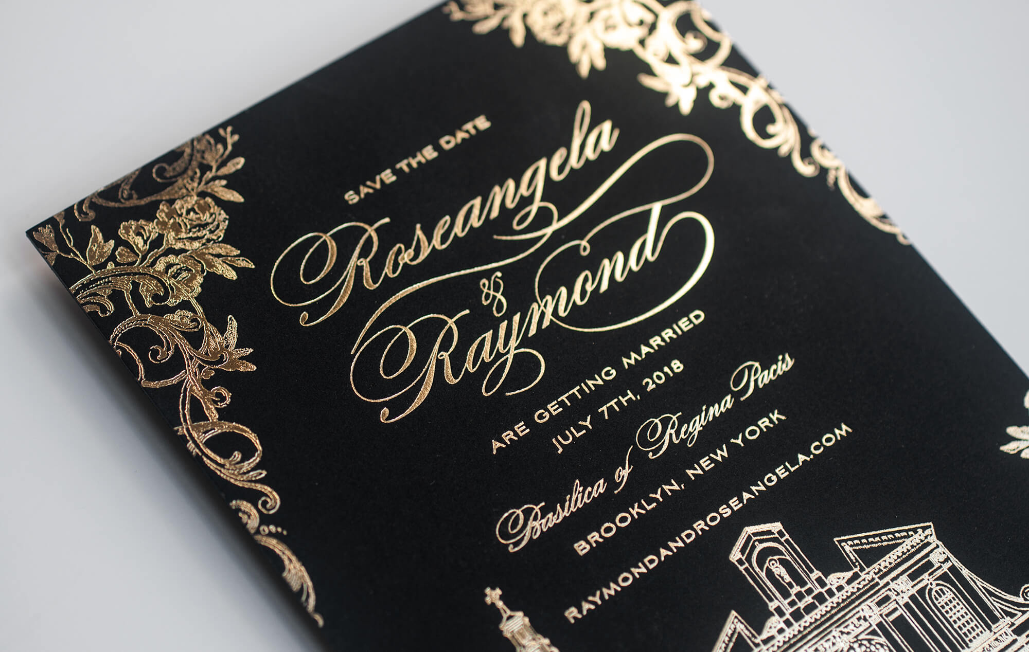 Gold lettering on a black save the date card