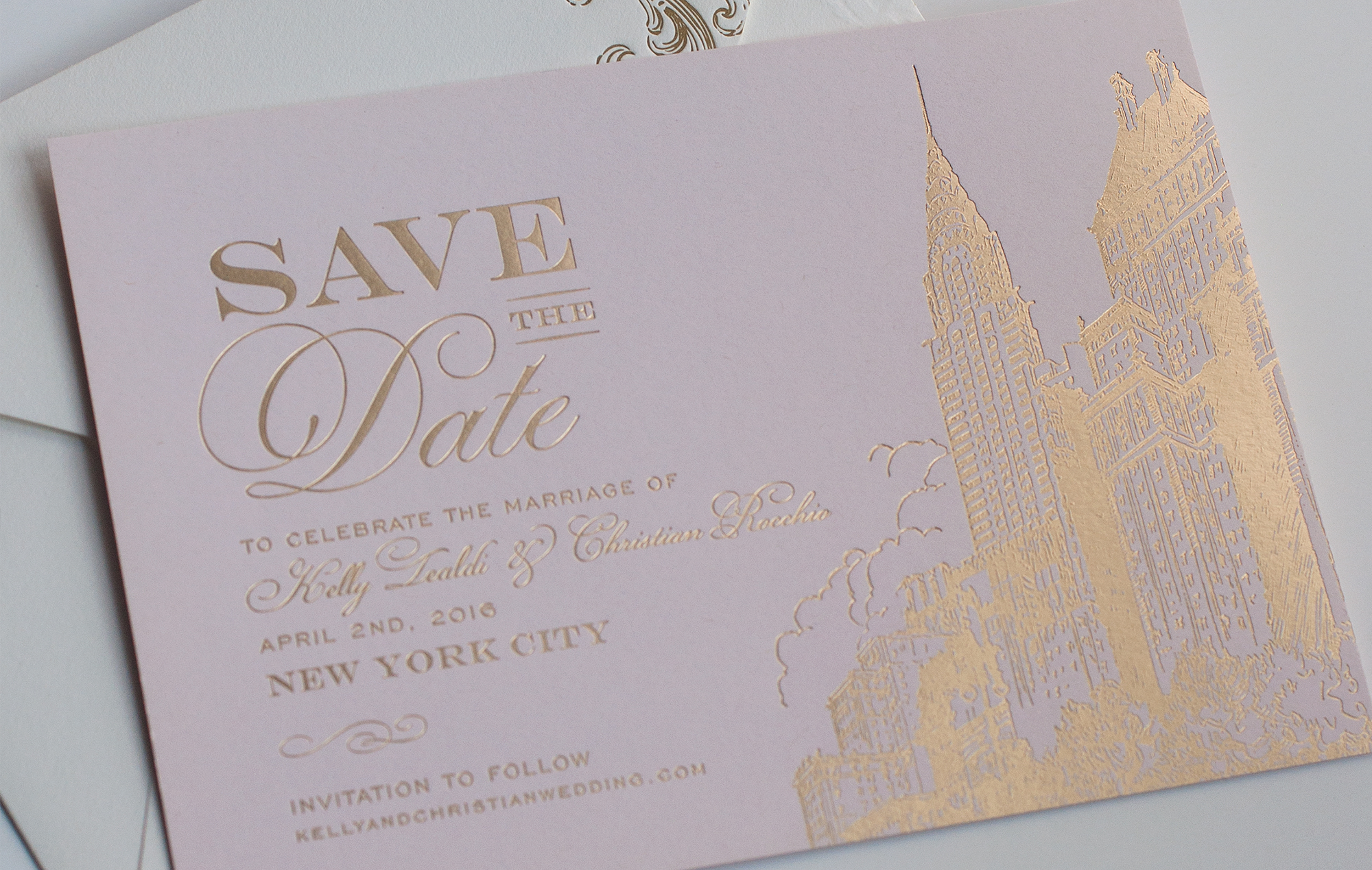 Gold skyline and Chrysler building on a pink save the date