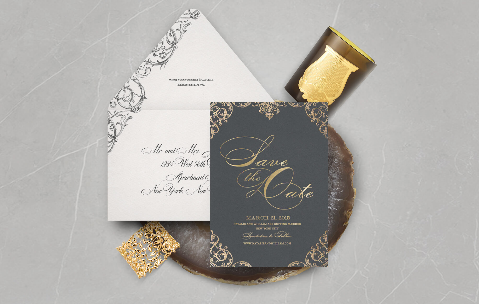Gold and charcoal scrollwork save the date
