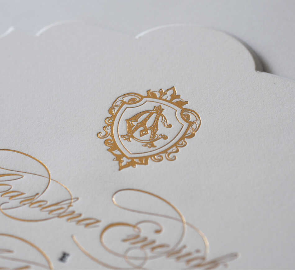 Gold foil crest with classic monogram initials