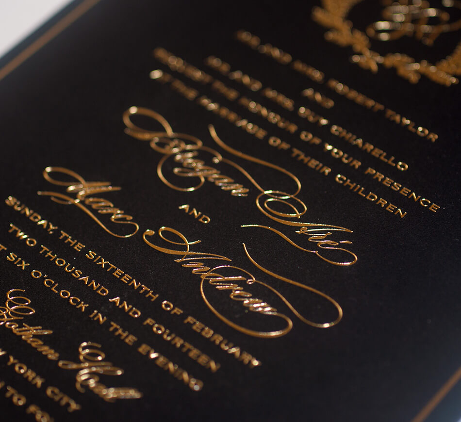 Gold calligraphy lettering on black paper