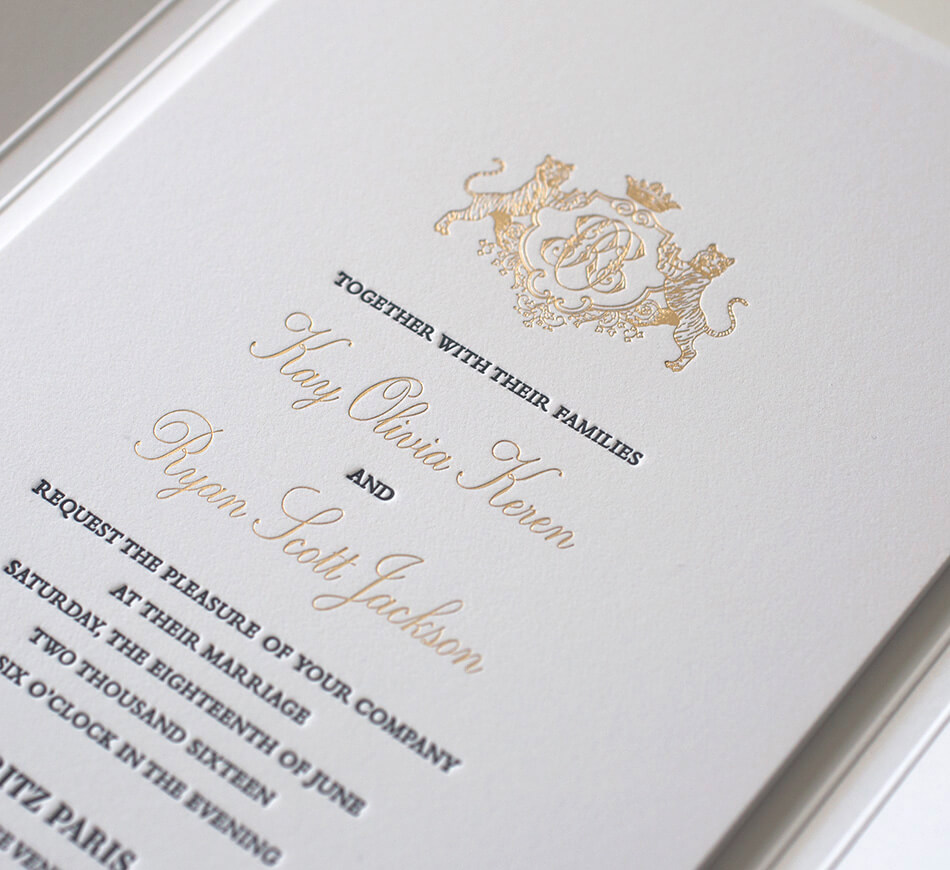 Gold foil invitation with tiger crest