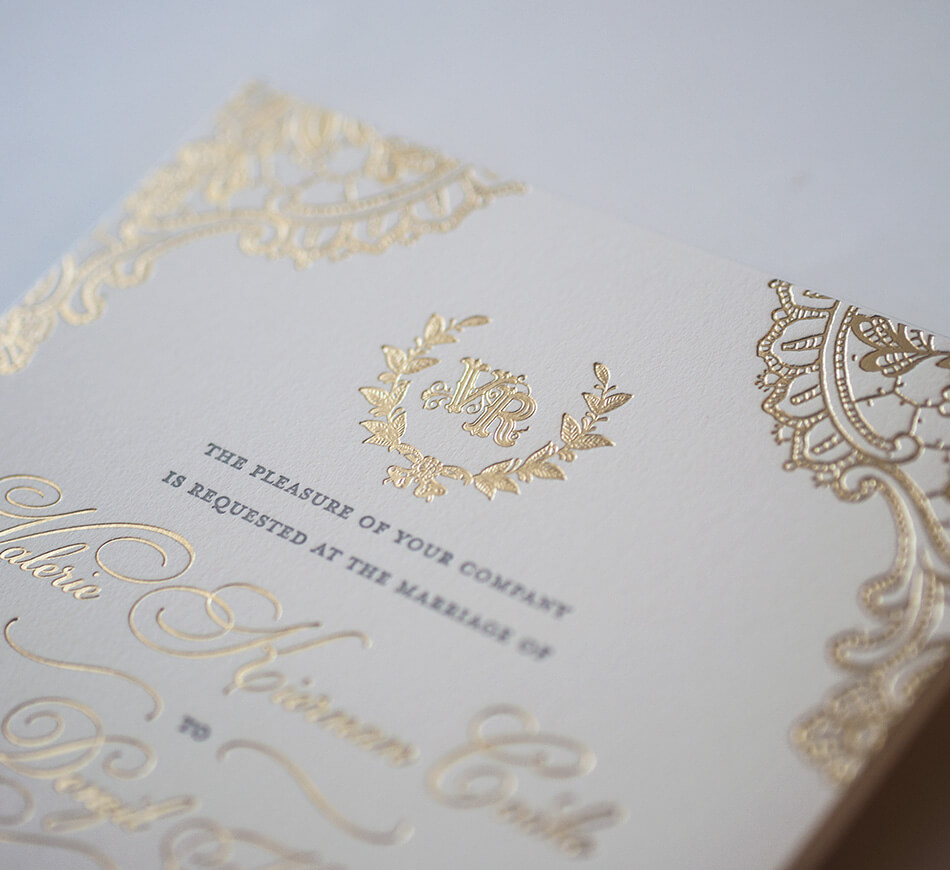 Gold monogram on invitation