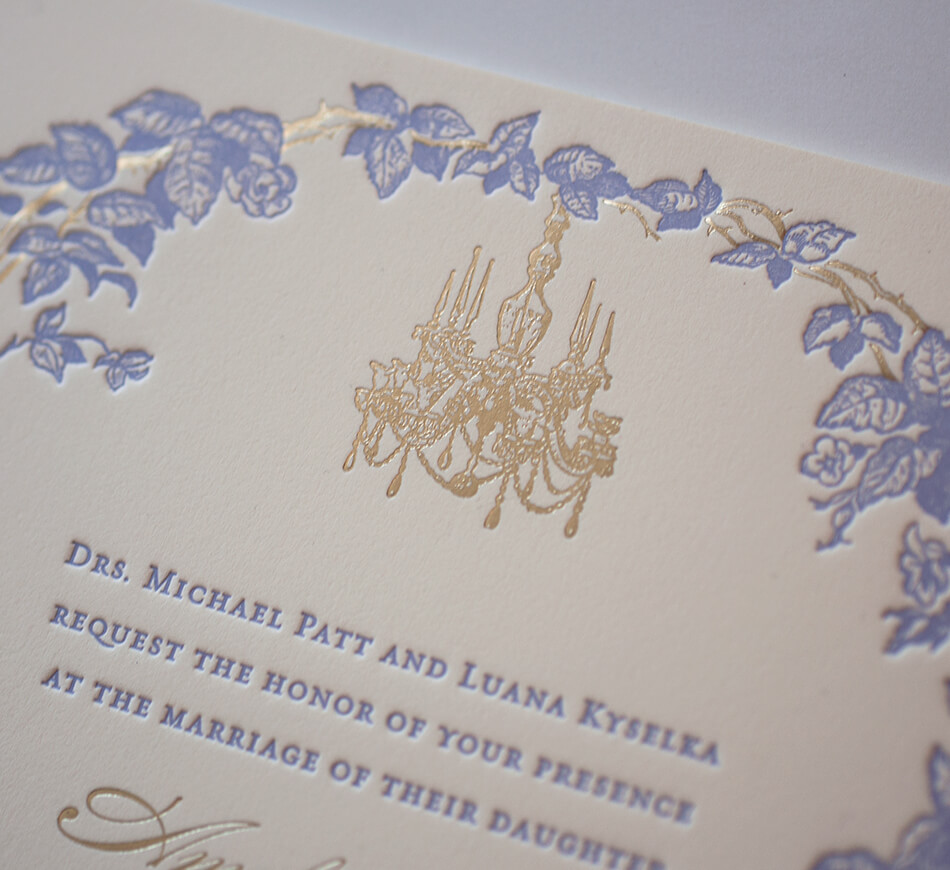 Gold chandelier and lilac letterpress trellis