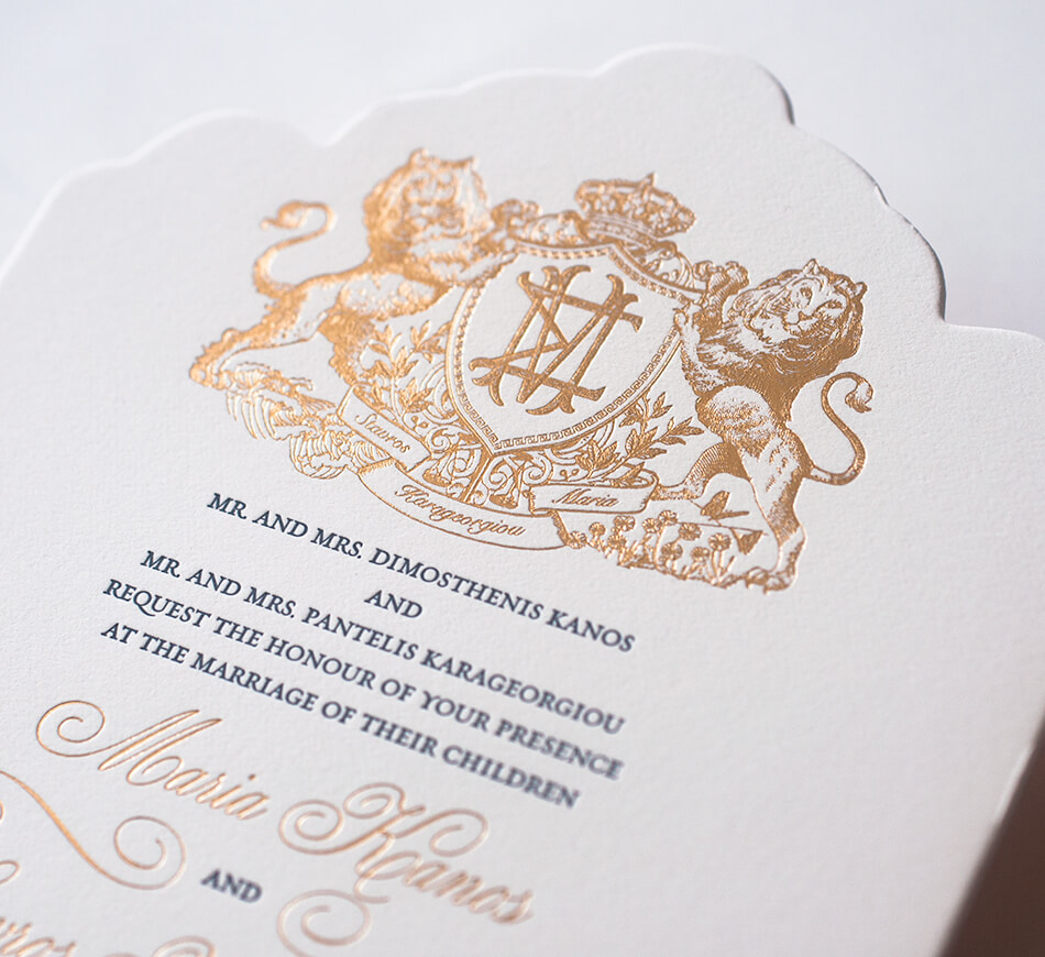 Gold foil lion crest on die cut invitation