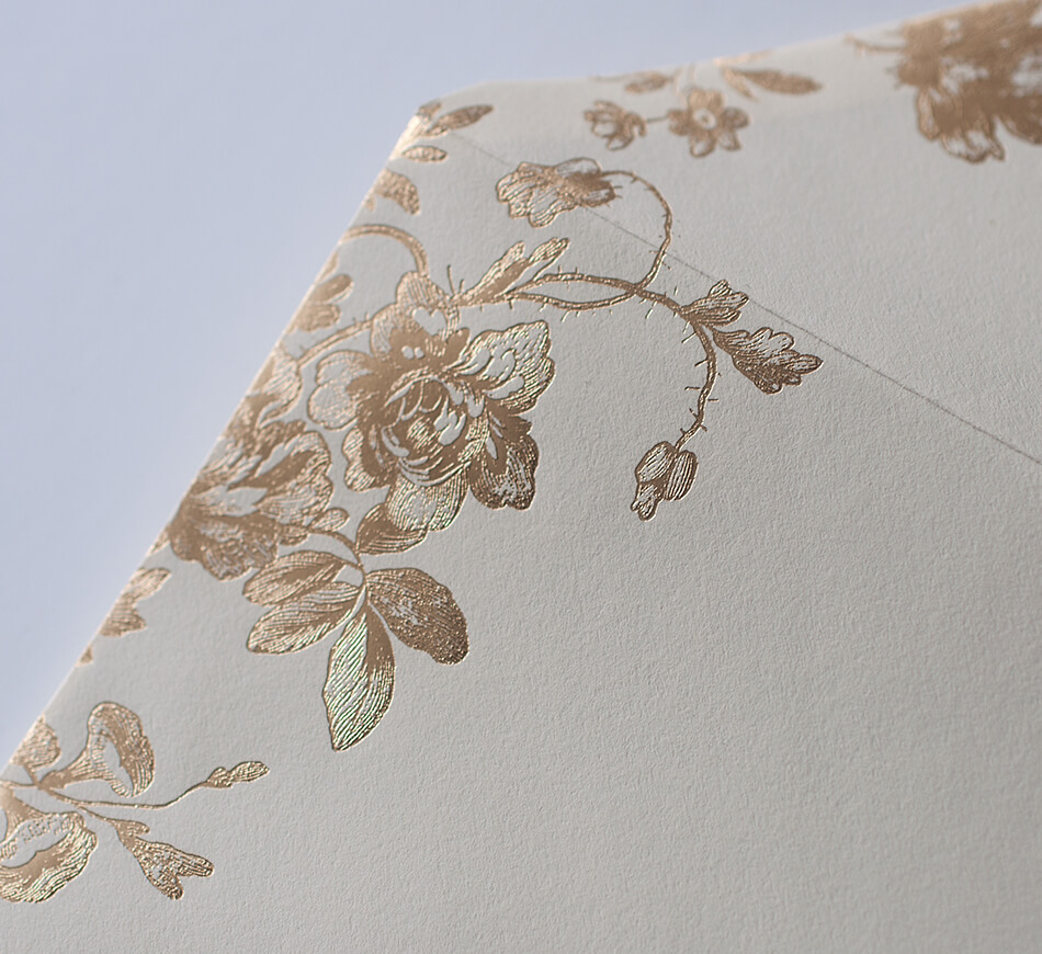 Gold foil peonies on an envelope