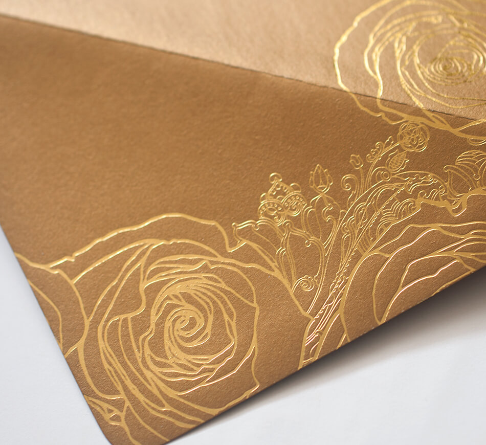 Gold foil stamped roses on a reply envelope