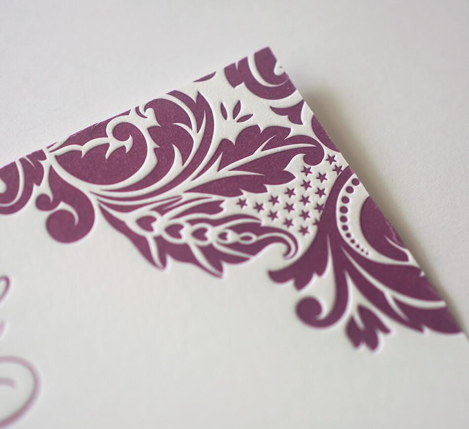 Letterpress scrollwork on reply card