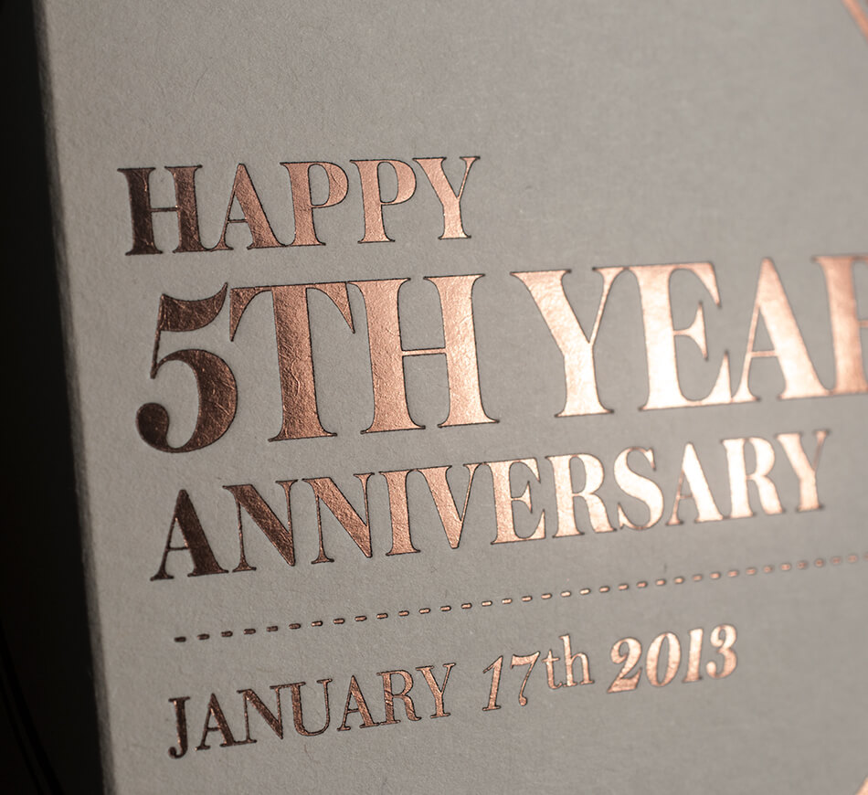 Brass foil typography on a wine box