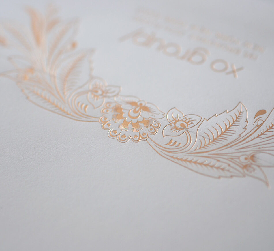 Gold foil floral motif on and envelope