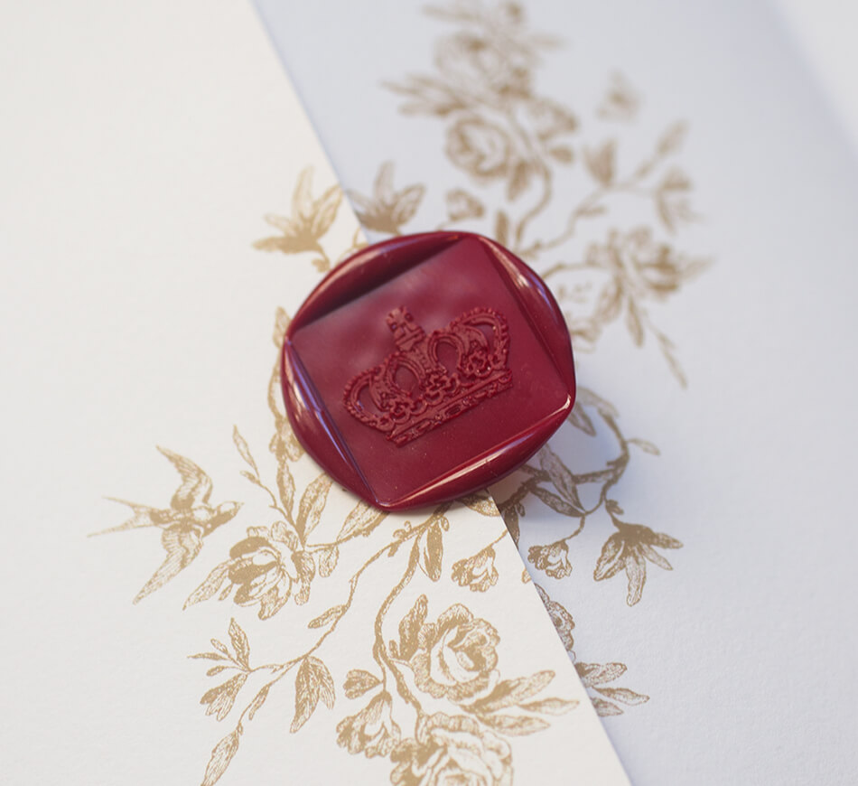 Red wax seal with a crown motif