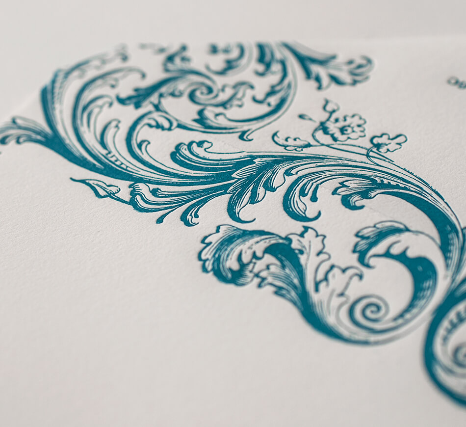 Teal scrollwork on envelope