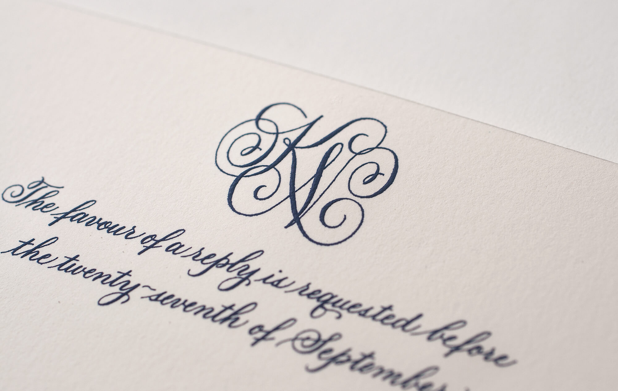 Engraved navy blue monogram