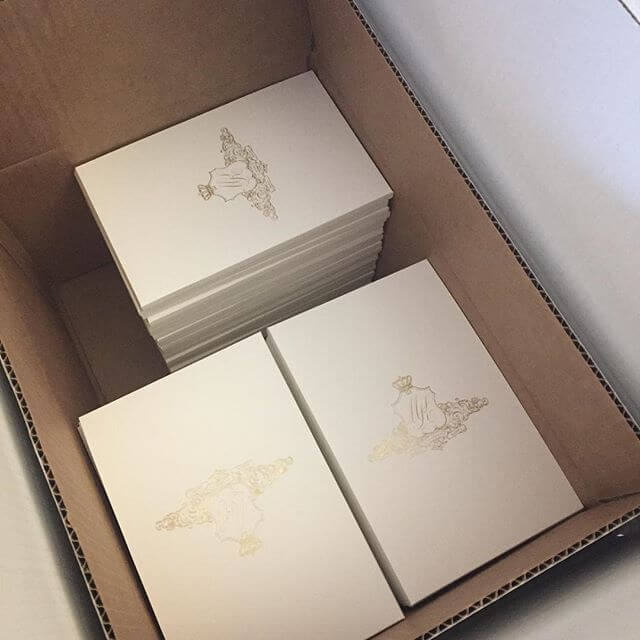 Gold foil crest invitations