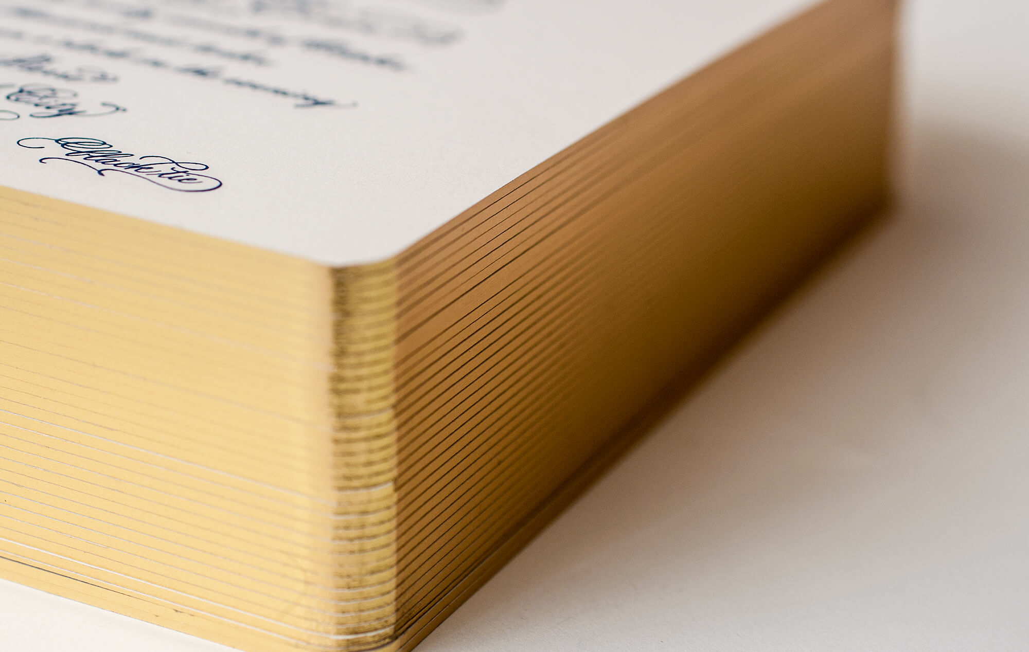 Gold edges on a classic wedding invitation