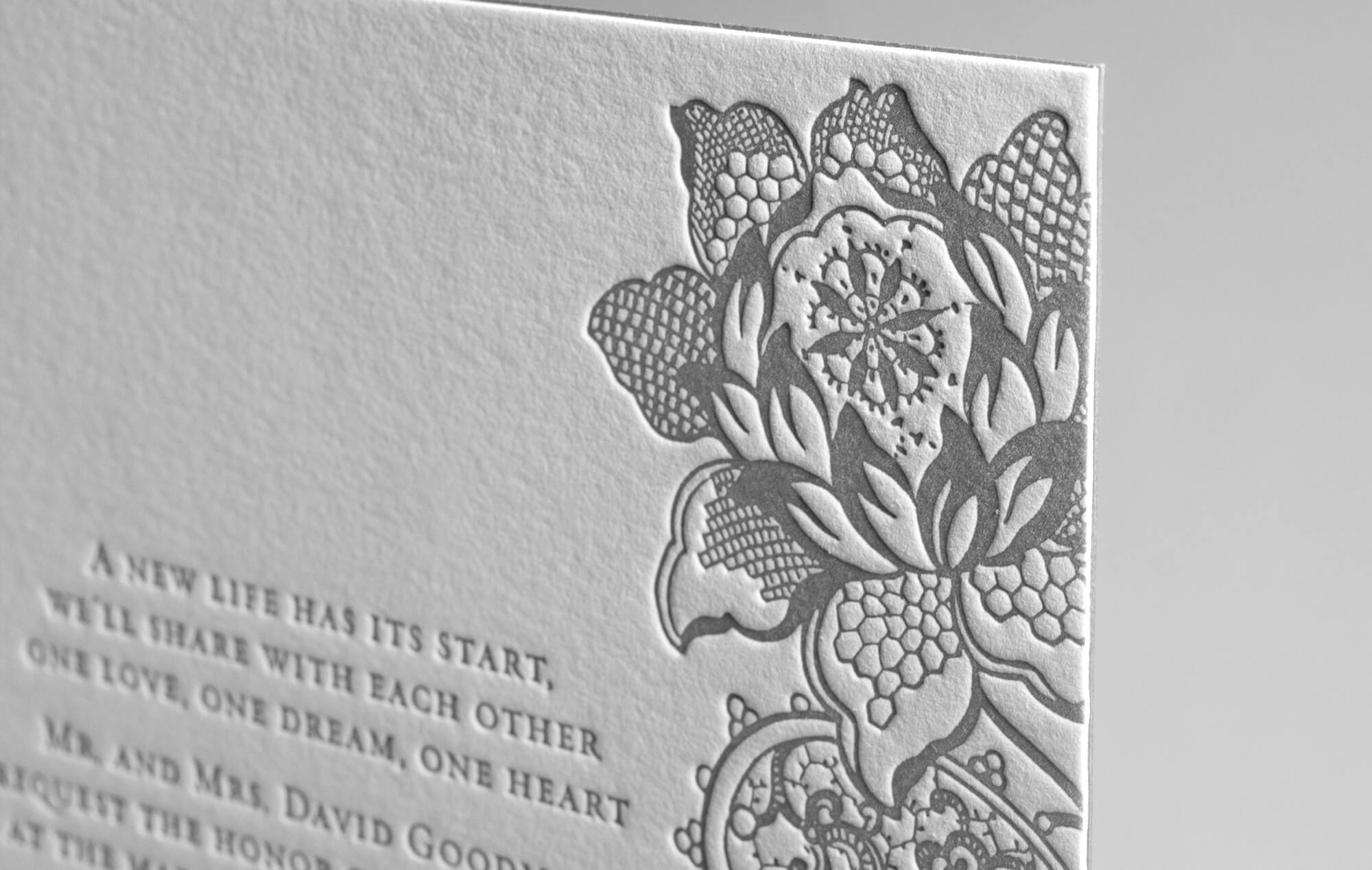 Letterpress lace flower on wedding invitation