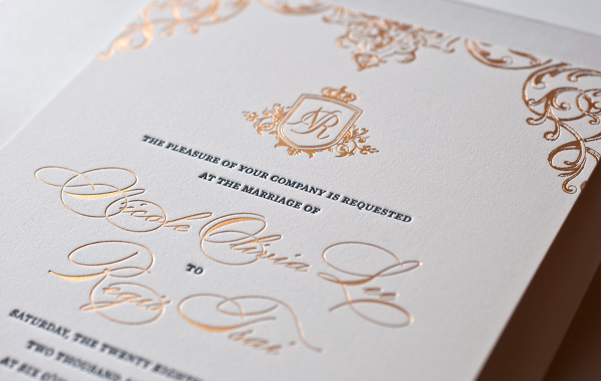 Ornate gold wedding invitation card