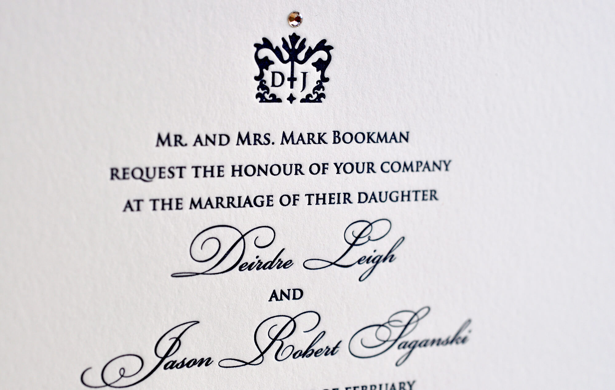 Simple letterpress wedding invitation with crown monogram